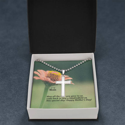 Polished stainless steel cross necklace with ball chain displayed in a luxury gift box with a To My Mom May All the Love You Gave Come Back Hundredfold Happy Mother's Day message card and pink zinnia flower background.