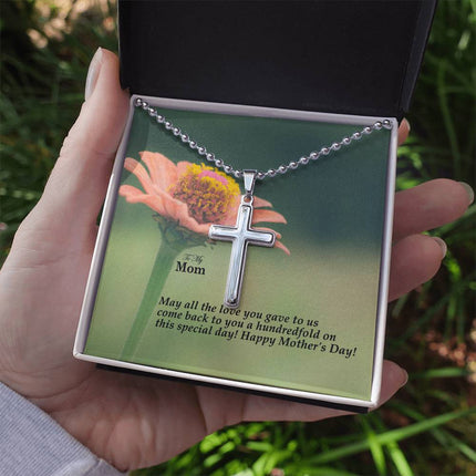 Polished stainless steel cross necklace with ball chain displayed in a luxury gift box with a To My Mom May All the Love You Gave Come Back Hundredfold Happy Mother's Day message card and pink zinnia flower background.