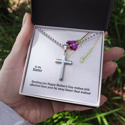 Polished stainless steel cross necklace with ball chain displayed in a luxury gift box with a To My Sister Sending Happy Mother's Day Wishes message card and purple wildflower background.
