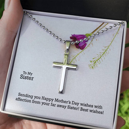 Polished stainless steel cross necklace with ball chain displayed in a luxury gift box with a To My Sister Sending Happy Mother's Day Wishes message card and purple wildflower background.