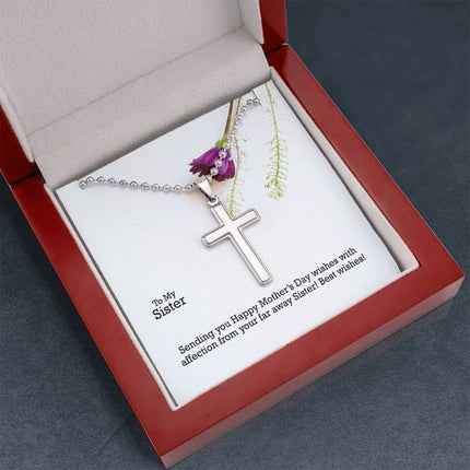 Polished stainless steel cross necklace with ball chain displayed in a luxury gift box with a To My Sister Sending Happy Mother's Day Wishes message card and purple wildflower background.