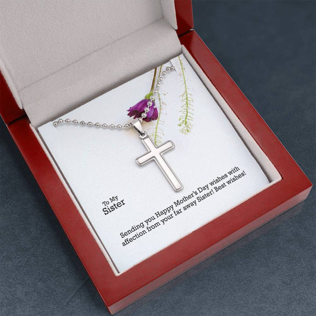 Polished stainless steel cross necklace with ball chain displayed in a luxury gift box with a To My Sister Sending Happy Mother's Day Wishes message card and purple wildflower background.