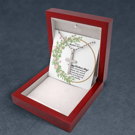 Polished stainless steel cross necklace with ball chain displayed in a luxury gift box with a Dearest Mother-in-Law Happy Mother's Day message card and watercolor floral wreath background.