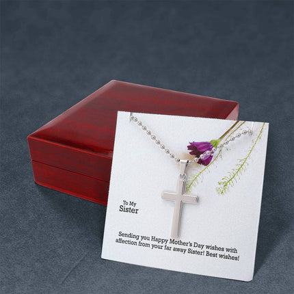 Polished stainless steel cross necklace with ball chain displayed in a luxury gift box with a To My Sister Sending Happy Mother's Day Wishes message card and purple wildflower background.