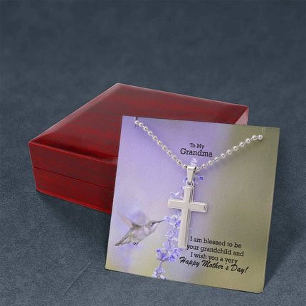 Polished stainless steel cross necklace with ball chain displayed in a luxury gift box with a To My Grandma I Am Blessed to Be Your Grandchild Happy Mother's Day message card and hummingbird lavender background.