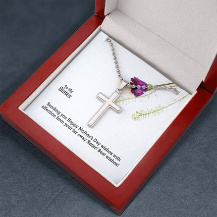 Polished stainless steel cross necklace with ball chain displayed in a luxury gift box with a To My Sister Sending Happy Mother's Day Wishes message card and purple wildflower background.