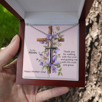 Polished stainless steel cross necklace with ball chain displayed in a mahogany luxury gift box with a To My Mom Thank You for Walking With the Lord Happy Mother's Day message card and purple floral cross background.