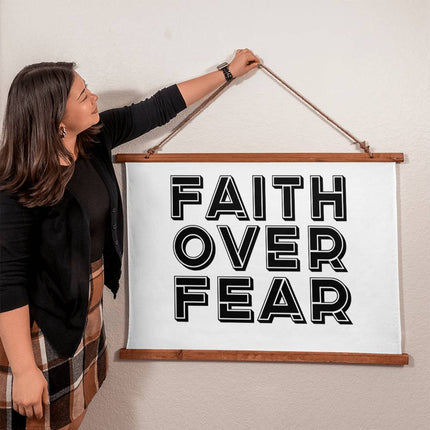 Faith over fear wood framed wall tapestry with bold black outline block text on white background – 36x26 horizontal Christian wall decor