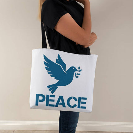 White classic tote bag with blue dove holding olive branch and “Peace” stencil text – Christian everyday tote with black straps