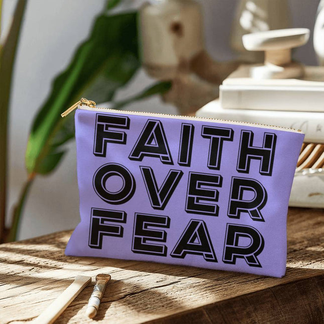 Faith over fear small fabric zippered pouch in lavender with outlined black block lettering – Christian accessory bag