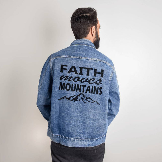 Men’s medium wash denim jacket with “Faith Moves Mountains” back print and mountain graphic in black – Christian faith apparel