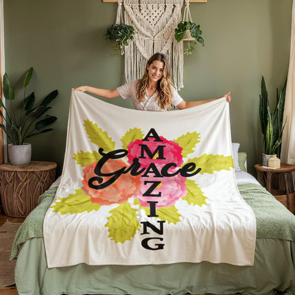 Amazing grace coral fleece blanket with pink and orange flowers and green leaves on cream background – cozy Christian throw blanket