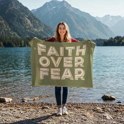 Green faith over fear fleece blanket with bold outlined lettering – cozy Christian throw