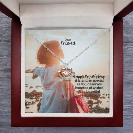Sterling silver and rose gold crown pendant necklace with a sparkling cubic zirconia center, displayed in a mahogany luxury LED gift box with a Dear Friend Happy Mother's Day message card.