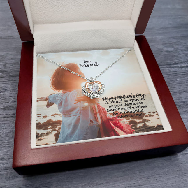 Sterling silver and rose gold crown pendant necklace with a sparkling cubic zirconia center, displayed in a mahogany luxury LED gift box with a Dear Friend Happy Mother's Day message card.