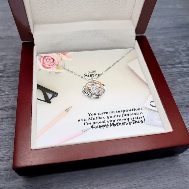Sterling silver and rose gold crown pendant necklace with a sparkling cubic zirconia center, displayed in a mahogany luxury LED gift box with a To My Sister Happy Mother's Day message card.
