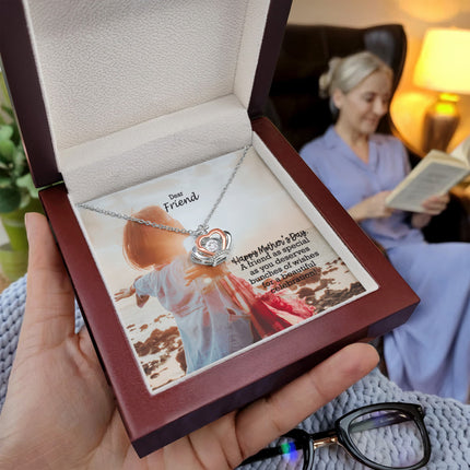 Sterling silver and rose gold crown pendant necklace with a sparkling cubic zirconia center, displayed in a mahogany luxury LED gift box with a Dear Friend Happy Mother's Day message card.