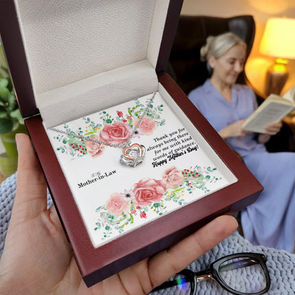 Sterling silver and rose gold crown pendant necklace with a sparkling cubic zirconia center, displayed in a mahogany luxury LED gift box with a To My Mother-in-Law Happy Mother's Day floral message card.