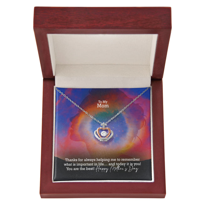 Sterling silver and rose gold crown pendant necklace with a sparkling cubic zirconia center, displayed in a mahogany luxury LED gift box with a To My Mom Happy Mother's Day message card.